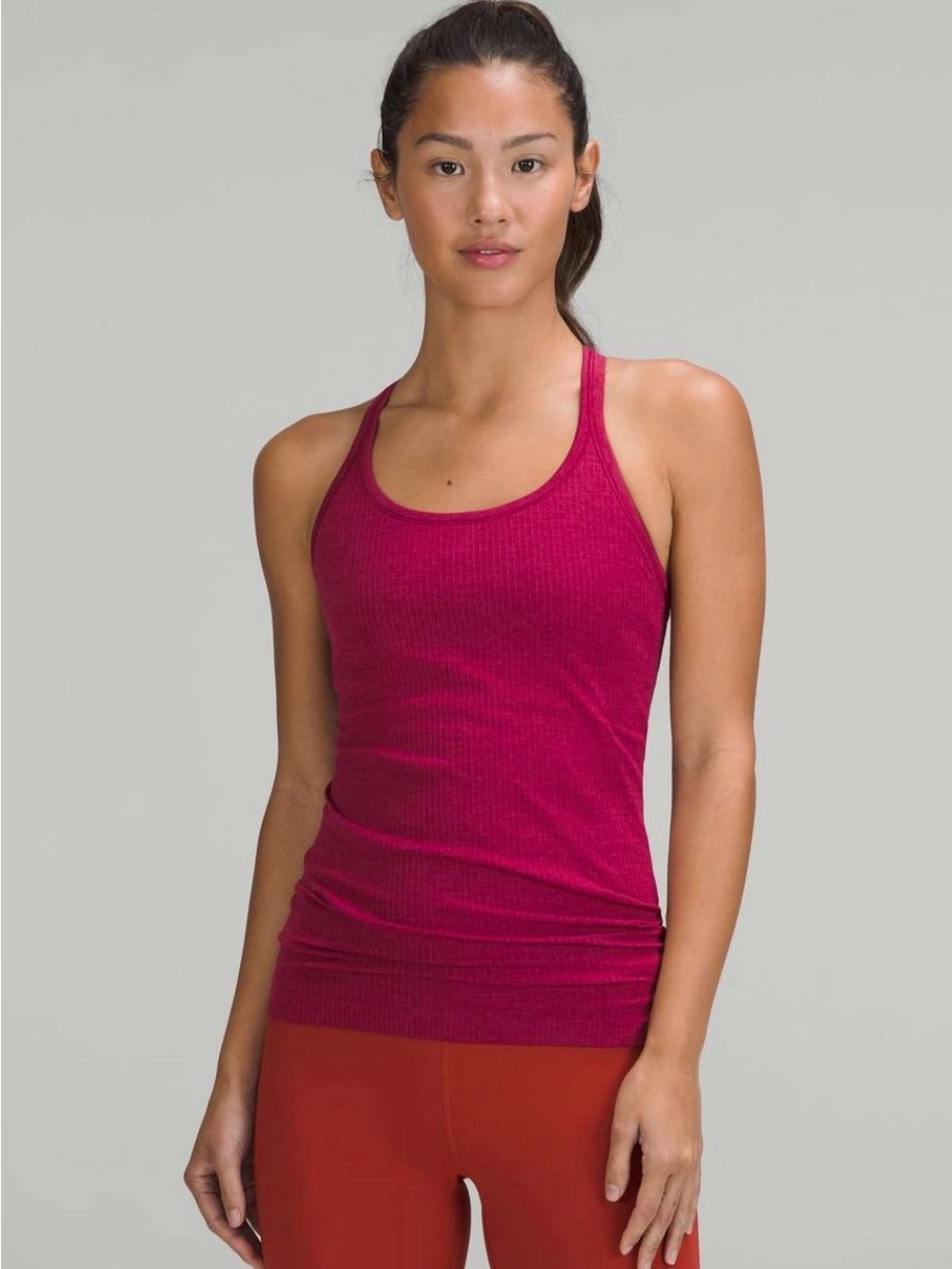 lululemon athletica women’s ebb to street tank top in color pomegranate
